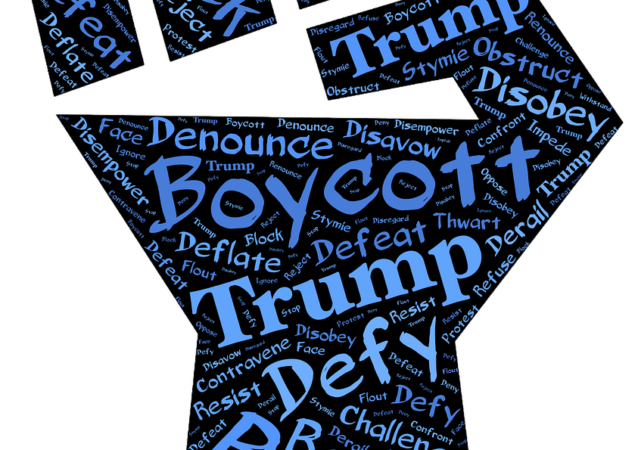A black fist with hundreds of blue words in it — including "boycott" "Trump" "Defy" Resist"